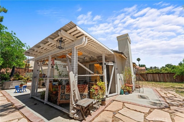 31941 Via Tafalla, Temecula, CA 92592 - back of property featuring a fenced backyard, a chimney, and a patio