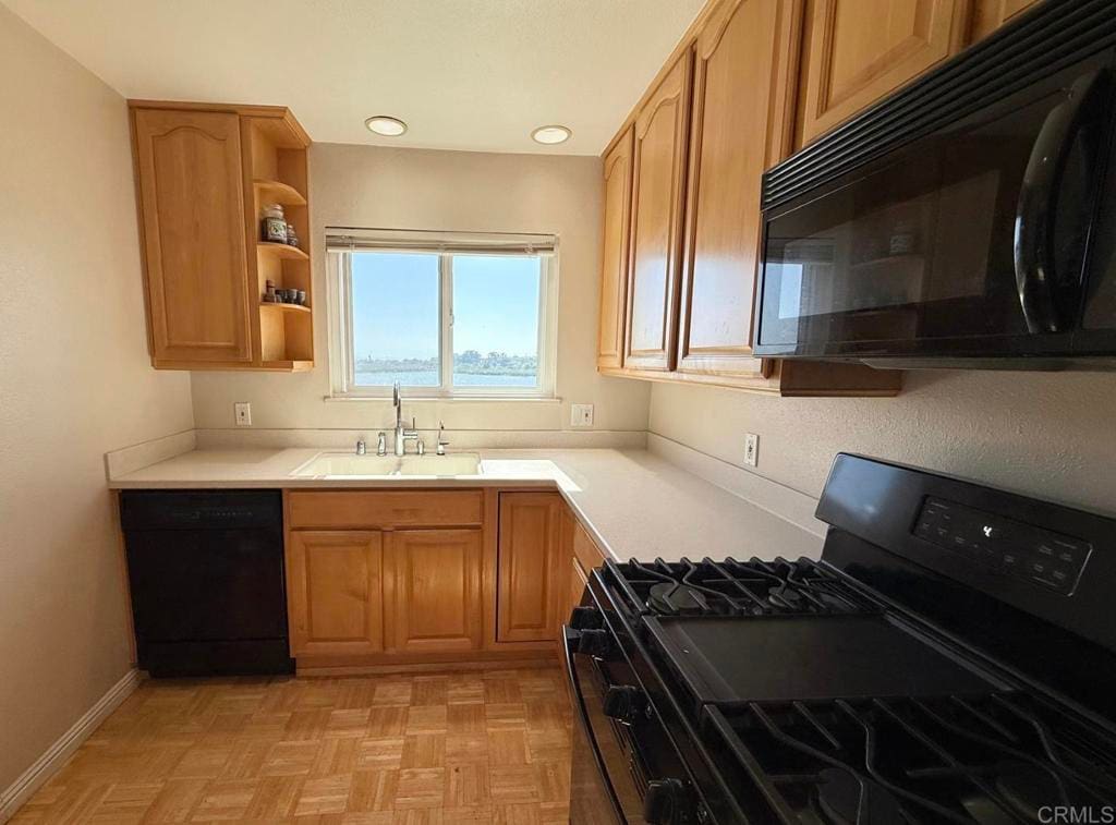 2525 Jefferson St Unit K, Carlsbad, CA 92008 - kitchen featuring black appliances, open shelves, light countertops, and recessed lighting