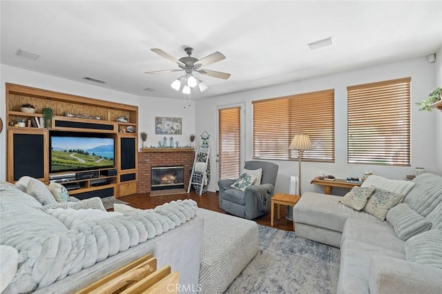 34722 Fairport Way, Yucaipa, CA 92399 - living area featuring ceiling fan, a fireplace, and wood finished floors