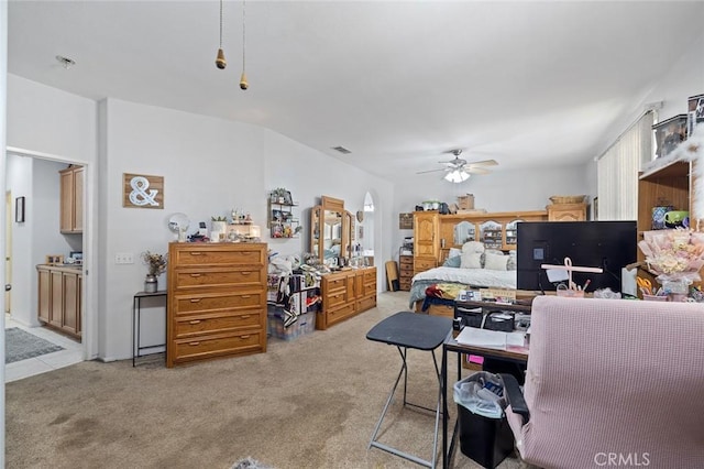 34722 Fairport Way, Yucaipa, CA 92399 - bedroom featuring light colored carpet, arched walkways, a ceiling fan, and ensuite bath