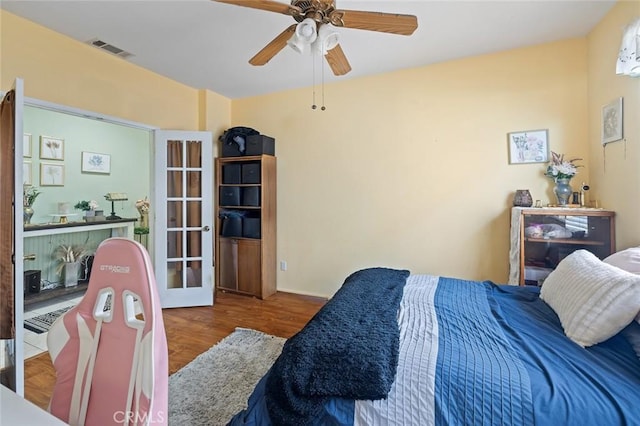 34722 Fairport Way, Yucaipa, CA 92399 - bedroom with wood finished floors, ceiling fan, and french doors