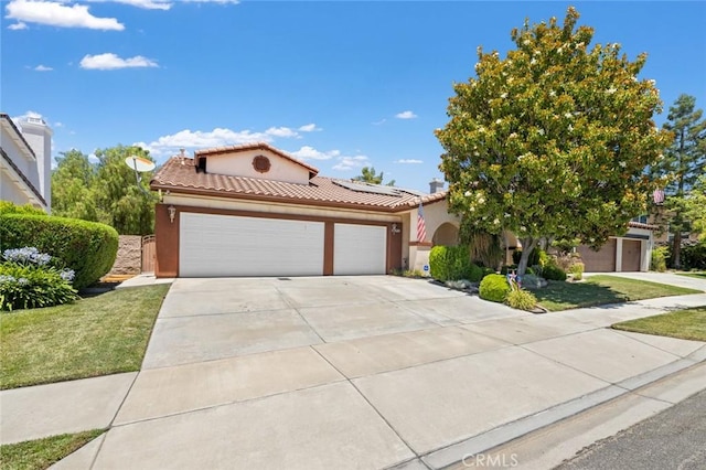 34722 Fairport Way, Yucaipa, CA 92399 - mediterranean / spanish home featuring a tile roof, an attached garage, solar panels, concrete driveway, and stucco siding