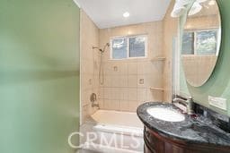 1097 Katherine Rd, Simi Valley, CA 93063 - bathroom with vanity, bathtub / shower combination, and plenty of natural light