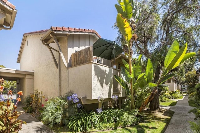 2352 Altisma Way Unit 13, Carlsbad, CA 92009 - view of side of home with a tiled roof