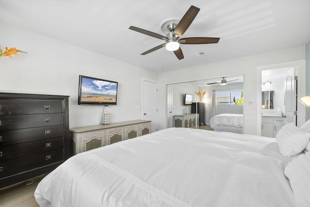 2352 Altisma Way Unit 13, Carlsbad, CA 92009 - bedroom with ceiling fan and connected bathroom