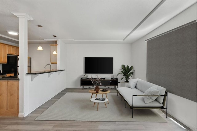 4074 48th St Unit 3, San Diego, CA 92105 - living area with light wood finished floors and ornate columns