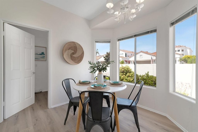 4981 Lerkas Way, Oceanside, CA 92056 - dining room with light wood-style floors, healthy amount of natural light, and a chandelier
