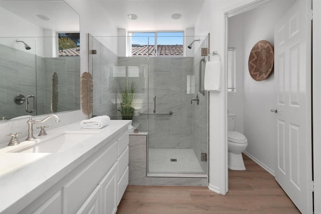 4981 Lerkas Way, Oceanside, CA 92056 - bathroom with vanity, a shower stall, and wood finished floors