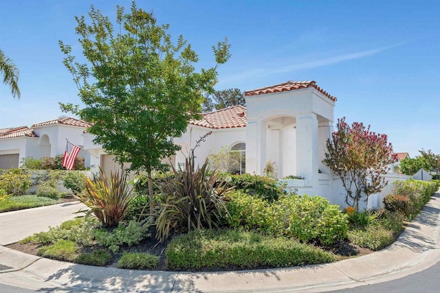 4981 Lerkas Way, Oceanside, CA 92056 - mediterranean / spanish house with a garage, a tile roof, stucco siding, and concrete driveway