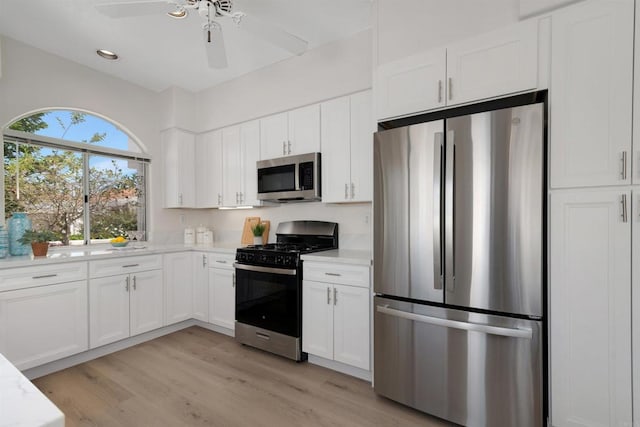 4981 Lerkas Way, Oceanside, CA 92056 - kitchen featuring stainless steel appliances, white cabinets, light wood finished floors, a ceiling fan, and recessed lighting