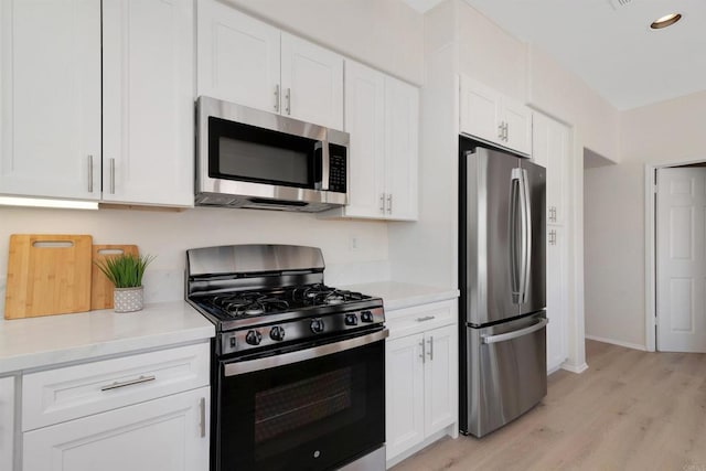 4981 Lerkas Way, Oceanside, CA 92056 - kitchen featuring stainless steel appliances, white cabinets, light wood-type flooring, light countertops, and recessed lighting