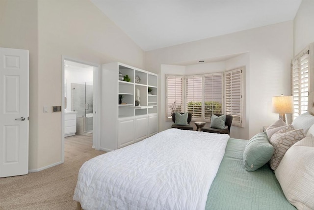 4981 Lerkas Way, Oceanside, CA 92056 - bedroom featuring multiple windows, vaulted ceiling, light carpet, and ensuite bath