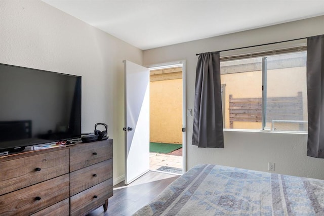 2041 E Grand Ave Unit 19, Escondido, CA 92027 - bedroom with wood finished floors and access to outside