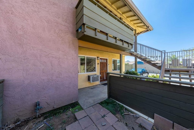 2041 E Grand Ave Unit 19, Escondido, CA 92027 - view of patio with stairway and a wall mounted air conditioner