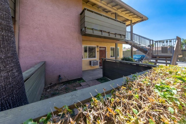 2041 E Grand Ave Unit 19, Escondido, CA 92027 - view of home's exterior featuring stairs and stucco siding