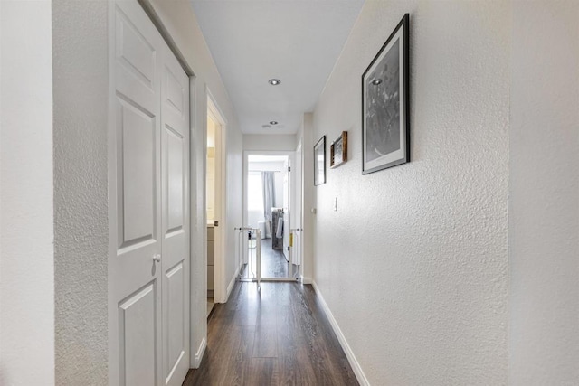 2041 E Grand Ave Unit 19, Escondido, CA 92027 - corridor with a textured wall and dark wood finished floors