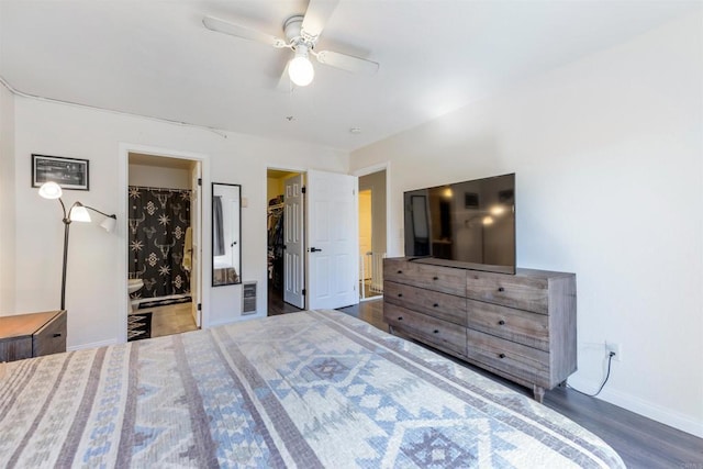 2041 E Grand Ave Unit 19, Escondido, CA 92027 - bedroom featuring wood finished floors, a walk in closet, a ceiling fan, and ensuite bathroom