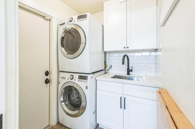 15716 Milne Cir, Moorpark, CA 93021 - laundry area featuring stacked washer / dryer and cabinet space