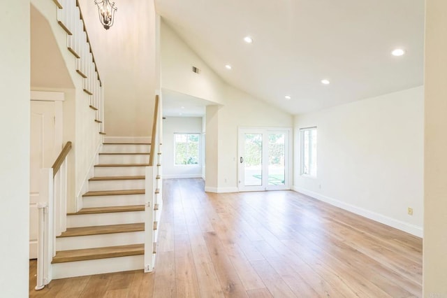 15716 Milne Cir, Moorpark, CA 93021 - unfurnished living room with light wood finished floors, stairs, recessed lighting, and high vaulted ceiling
