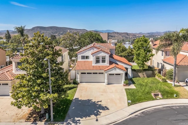 15716 Milne Cir, Moorpark, CA 93021 - mediterranean / spanish-style house with a tiled roof, concrete driveway, stucco siding, and a mountain view