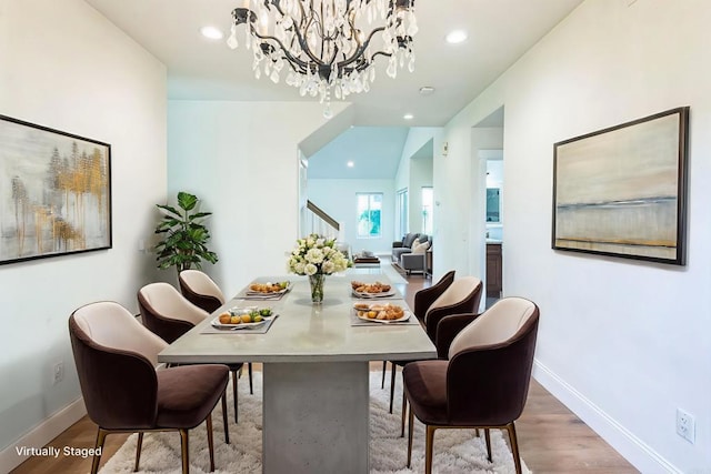 15716 Milne Cir, Moorpark, CA 93021 - dining area with stairs, wood finished floors, a chandelier, and recessed lighting