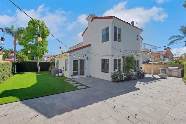 15716 Milne Cir, Moorpark, CA 93021 - back of house with a fenced backyard, stucco siding, and a patio