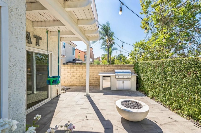 15716 Milne Cir, Moorpark, CA 93021 - fenced backyard with a patio and an outdoor kitchen