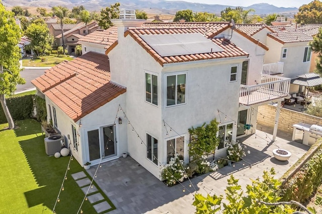 15716 Milne Cir, Moorpark, CA 93021 - back of property featuring a tile roof, a mountain view, and a balcony