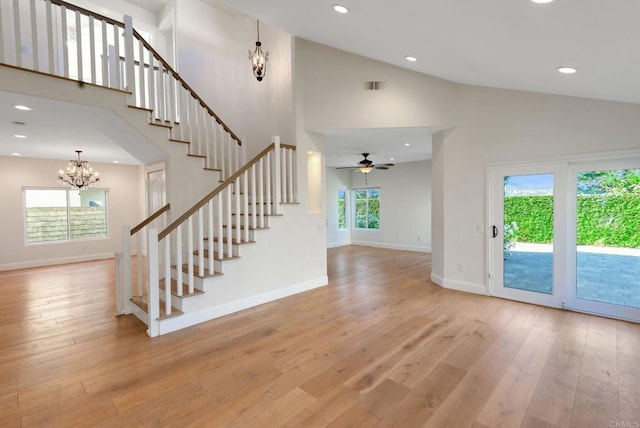 15716 Milne Cir, Moorpark, CA 93021 - foyer entrance with high vaulted ceiling, stairway, a chandelier, light wood-type flooring, and recessed lighting