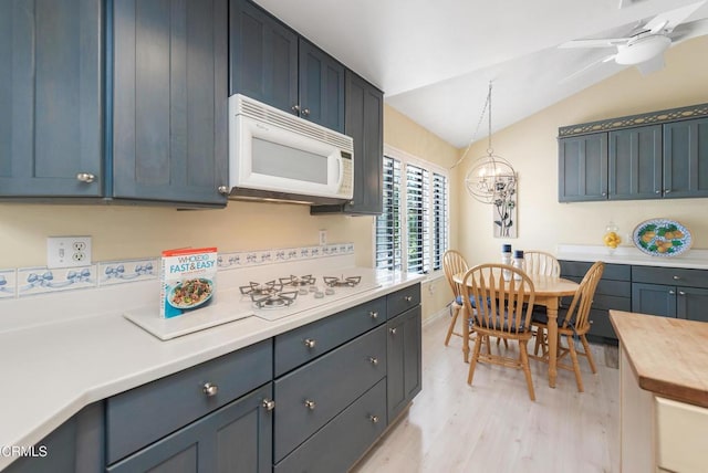6357 Irena Ave, Camarillo, CA 93012 - kitchen featuring white appliances, vaulted ceiling, light wood-style flooring, hanging light fixtures, and a ceiling fan