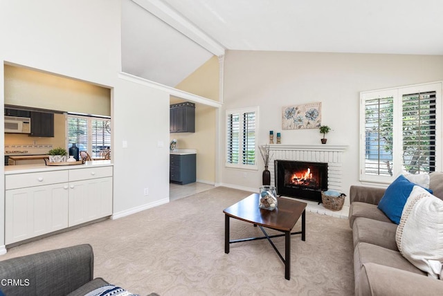 6357 Irena Ave, Camarillo, CA 93012 - living area featuring beam ceiling, a brick fireplace, light colored carpet, and high vaulted ceiling
