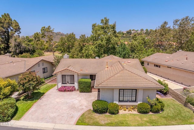 6357 Irena Ave, Camarillo, CA 93012 - mediterranean / spanish house with driveway, a tiled roof, and stucco siding