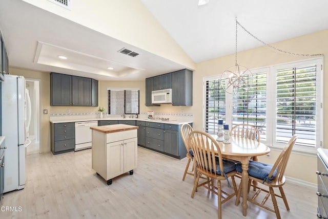 6357 Irena Ave, Camarillo, CA 93012 - kitchen featuring white appliances, wood counters, light wood finished floors, a center island, and a chandelier