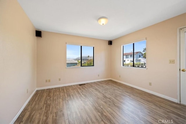 1232 10th St, Los Osos, CA 93402 - unfurnished room featuring plenty of natural light and wood finished floors