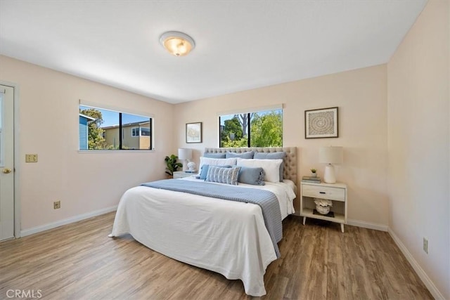 1232 10th St, Los Osos, CA 93402 - bedroom with multiple windows and wood finished floors