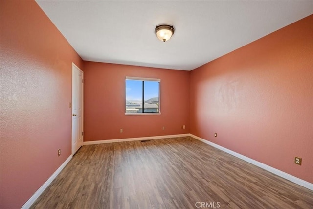 1232 10th St, Los Osos, CA 93402 - unfurnished room featuring wood finished floors and baseboards