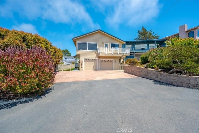 1232 10th St, Los Osos, CA 93402 - view of front of house featuring driveway, stairway, and a garage