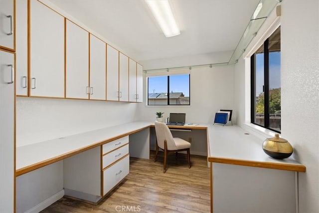 1232 10th St, Los Osos, CA 93402 - home office with built in desk, healthy amount of natural light, and light wood finished floors