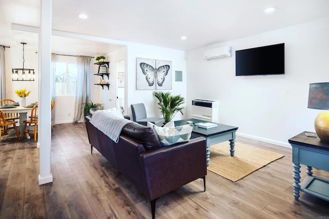 1298 Willowside, Alpine, CA 91901 - living area with an AC wall unit, wood finished floors, a chandelier, heating unit, and recessed lighting