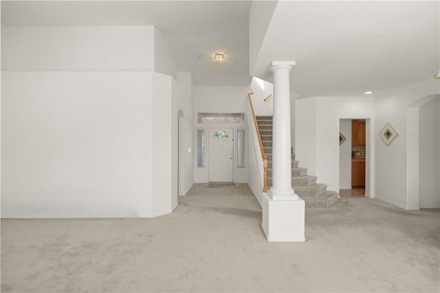10527 Rose River Falls Ave, Bakersfield, CA 93312 - entryway with carpet floors, stairway, and arched walkways