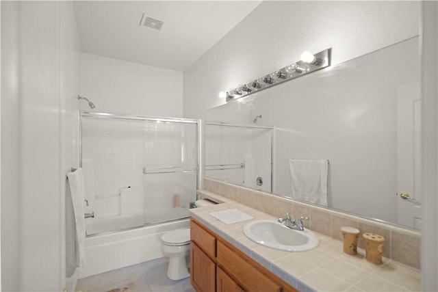10527 Rose River Falls Ave, Bakersfield, CA 93312 - bathroom featuring vanity, bath / shower combo with glass door, and tile patterned flooring