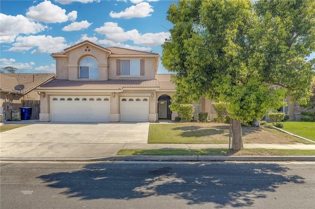 10527 Rose River Falls Ave, Bakersfield, CA 93312 - mediterranean / spanish house featuring stucco siding, driveway, an attached garage, a tile roof, and a front lawn