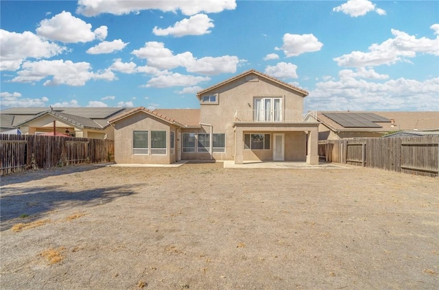 10527 Rose River Falls Ave, Bakersfield, CA 93312 - back of house with stucco siding, a fenced backyard, a patio area, and a tile roof