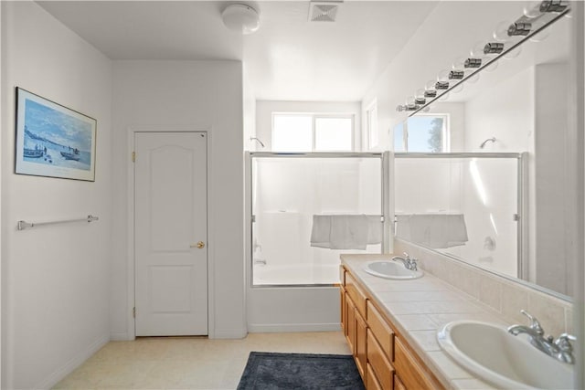 10527 Rose River Falls Ave, Bakersfield, CA 93312 - full bath featuring double vanity and enclosed tub / shower combo