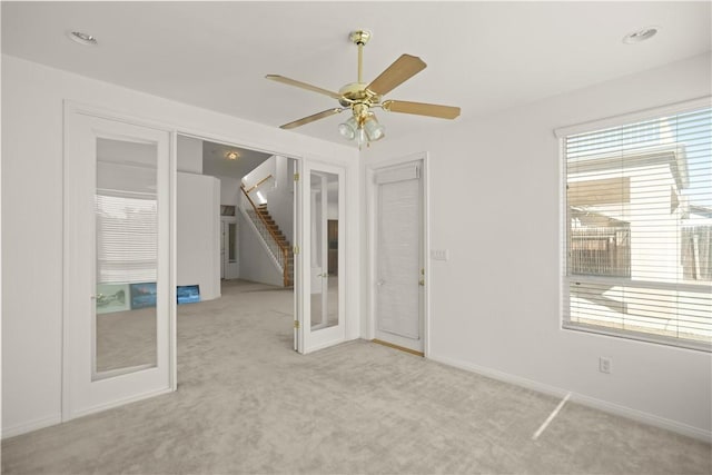 10527 Rose River Falls Ave, Bakersfield, CA 93312 - carpeted spare room with ceiling fan, french doors, and stairway