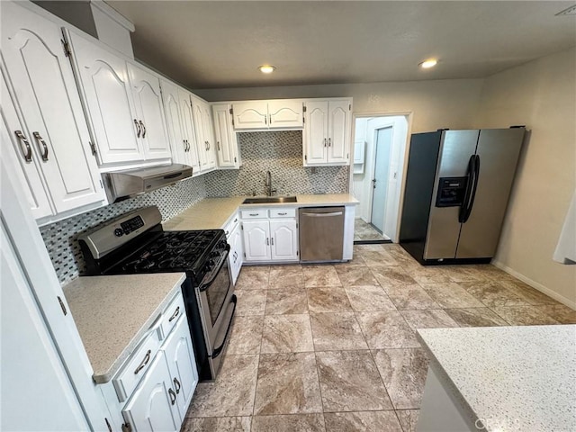 4021 York Blvd, Glassell Park, CA 90065 - kitchen featuring stainless steel appliances, white cabinets, decorative backsplash, light countertops, and recessed lighting