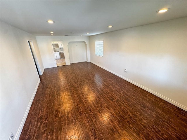 4021 York Blvd, Glassell Park, CA 90065 - spare room featuring arched walkways, dark wood-type flooring, and recessed lighting