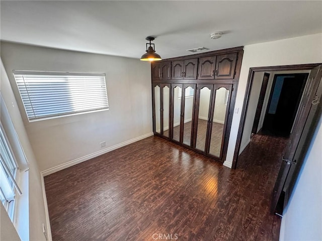 4021 York Blvd, Glassell Park, CA 90065 - unfurnished bedroom featuring dark wood-type flooring and baseboards