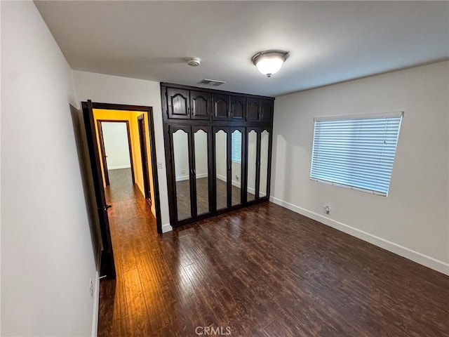4021 York Blvd, Glassell Park, CA 90065 - unfurnished bedroom featuring dark wood finished floors and baseboards