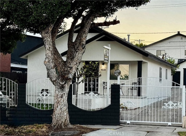 4021 York Blvd, Glassell Park, CA 90065 - view of front of home featuring a gate and stucco siding